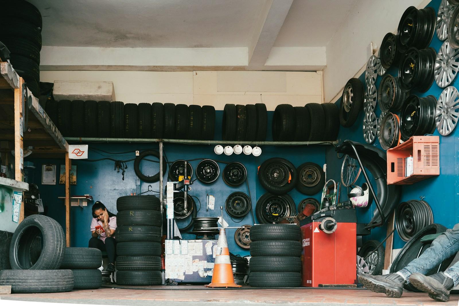 Shelves of tyres and parts in an auto workshop