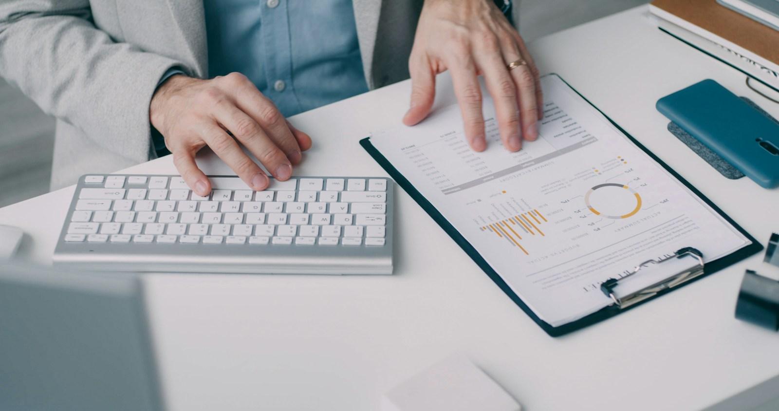 An accountant reviewing financial statements at a desk