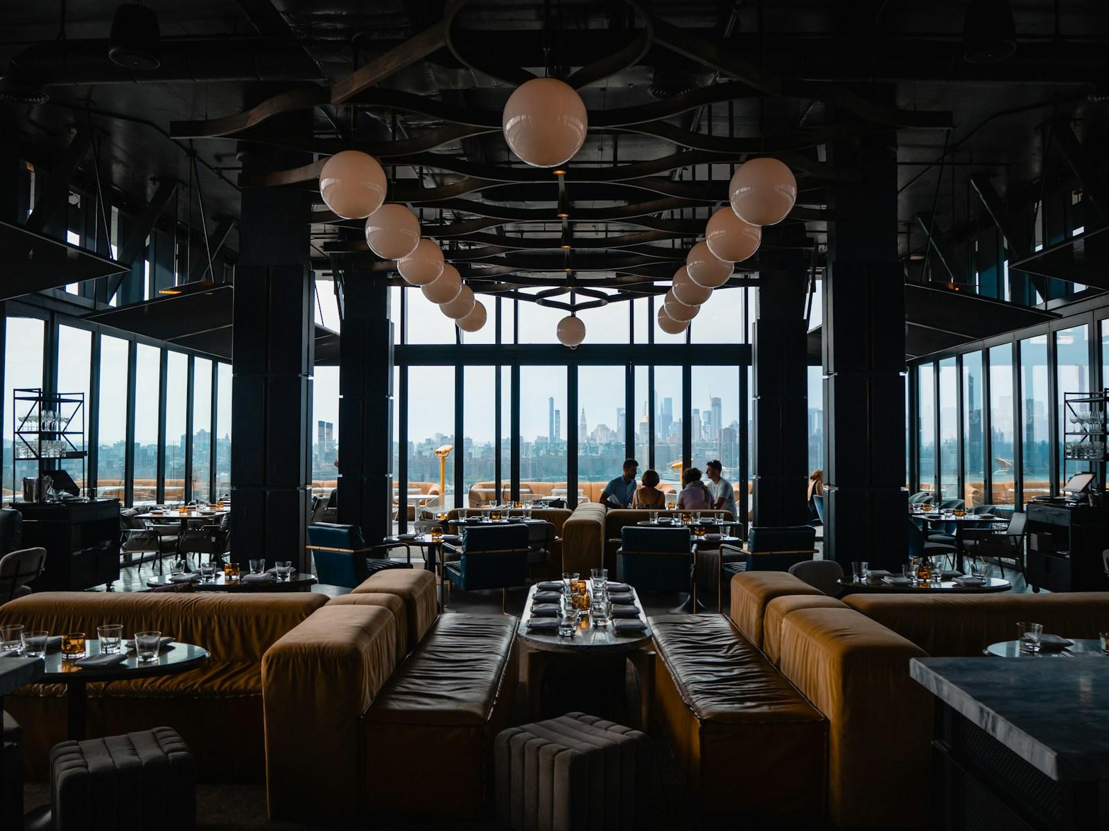 A restaurant dining room set for service